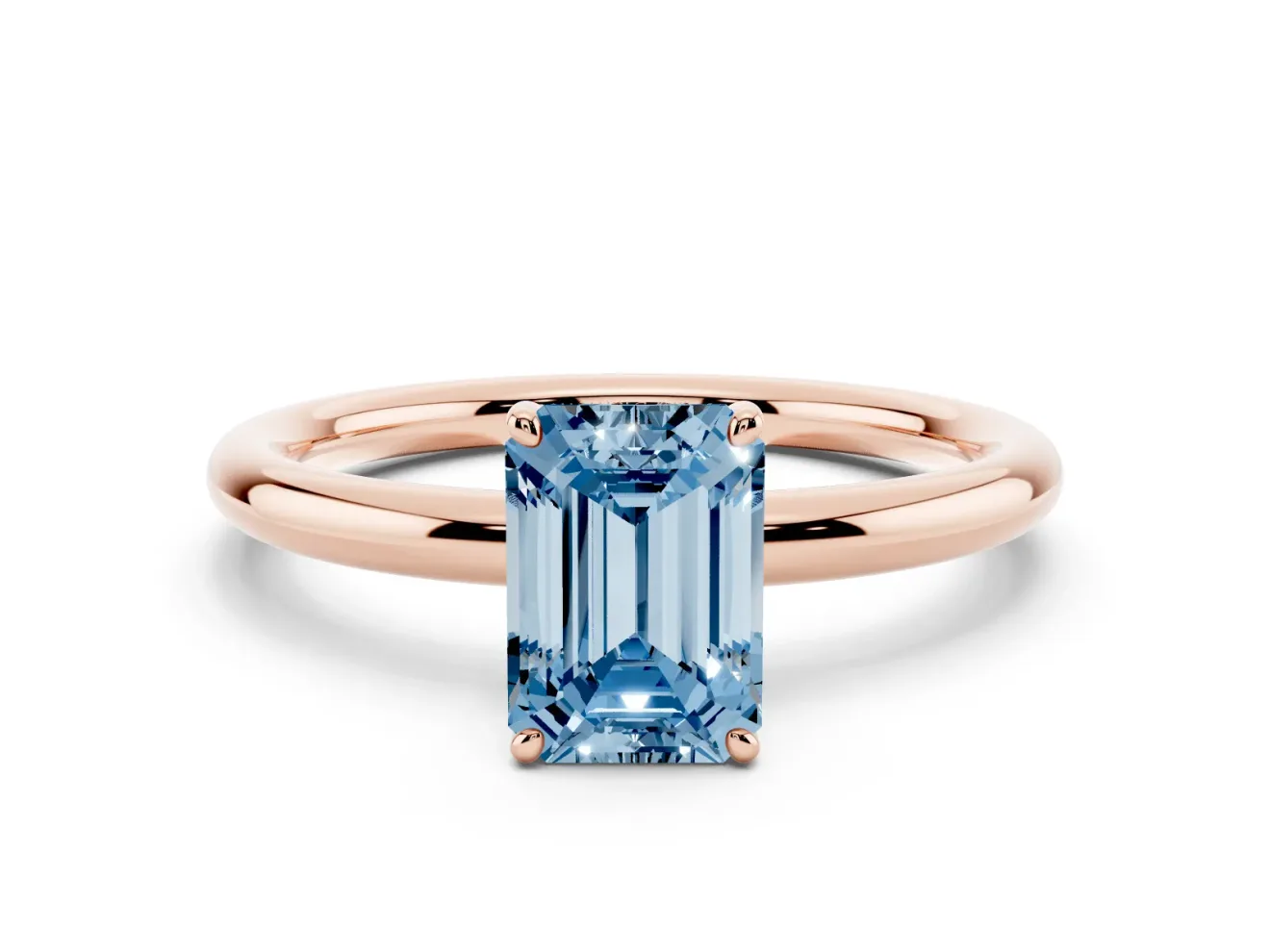 Fancy Blue Emerald Cut Diamond Solitaire Ring Set in Rose gold with Prong Setting on a Polished Plain Band