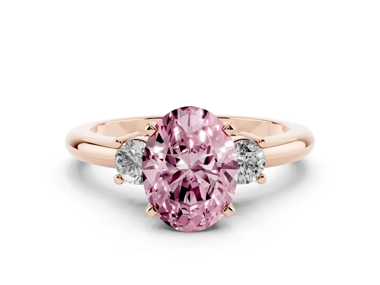 Fancy Pink Three-Stone Oval Cut Diamond Ring Set in Rose gold with Prong Setting and Plain Band