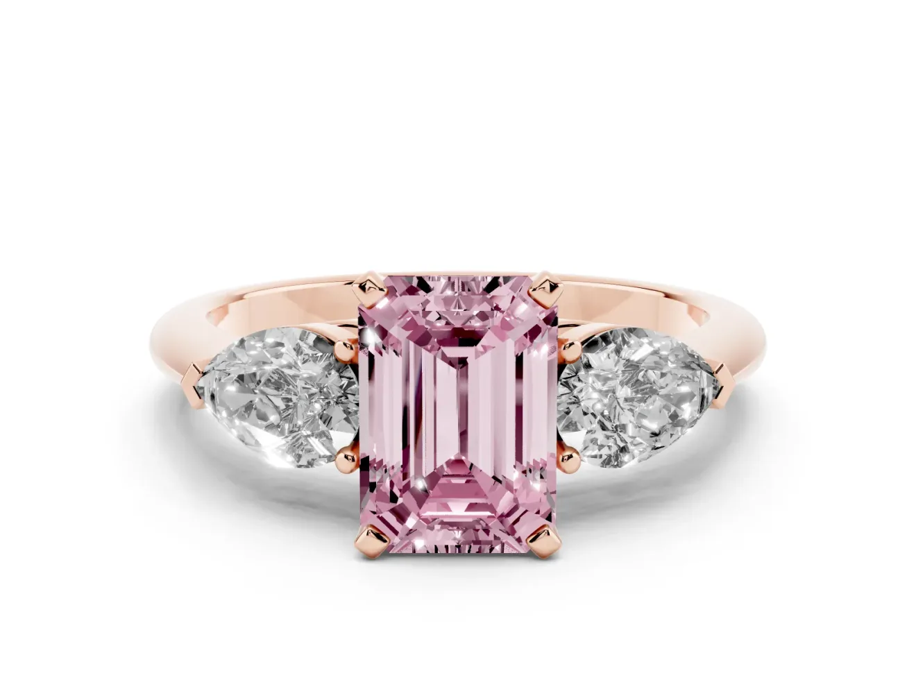 Fancy Pink Three-Stone Emerald Cut Diamond Ring Set in Rose gold with Pear Side Stones and Prong Setting