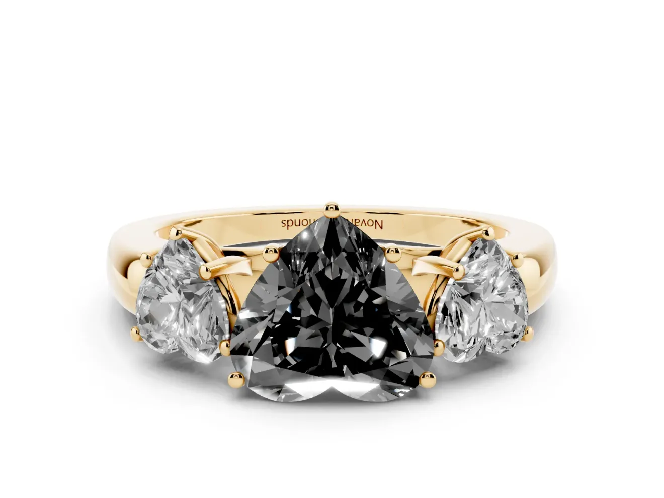 Fancy Black Heart Cut Diamond Three-Stone Ring Set in Yellow gold with Bold Center and Classic Band