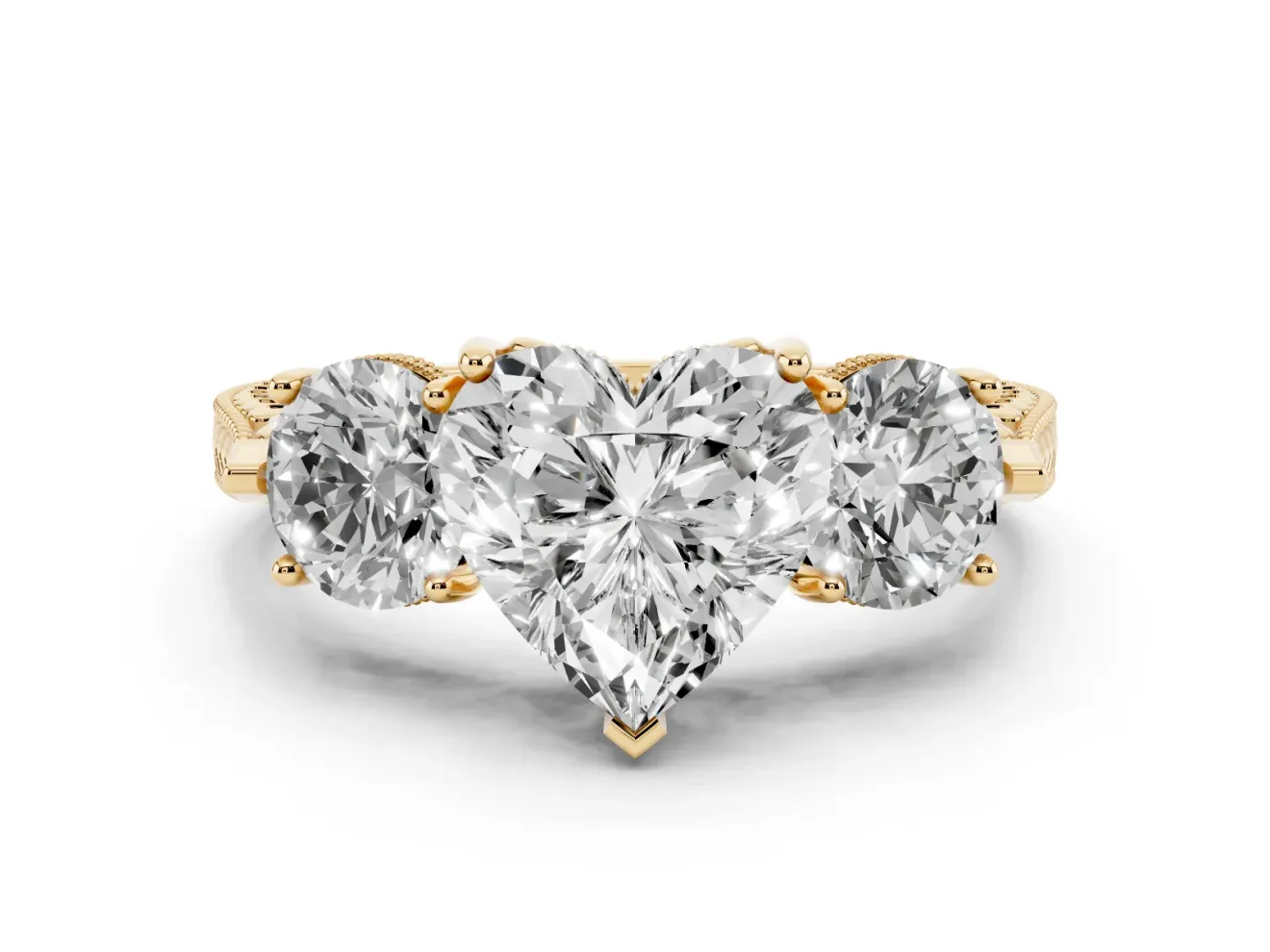 Heart Cut Diamond Three-Stone Ring Set in Yellow gold with Milgrain Band
