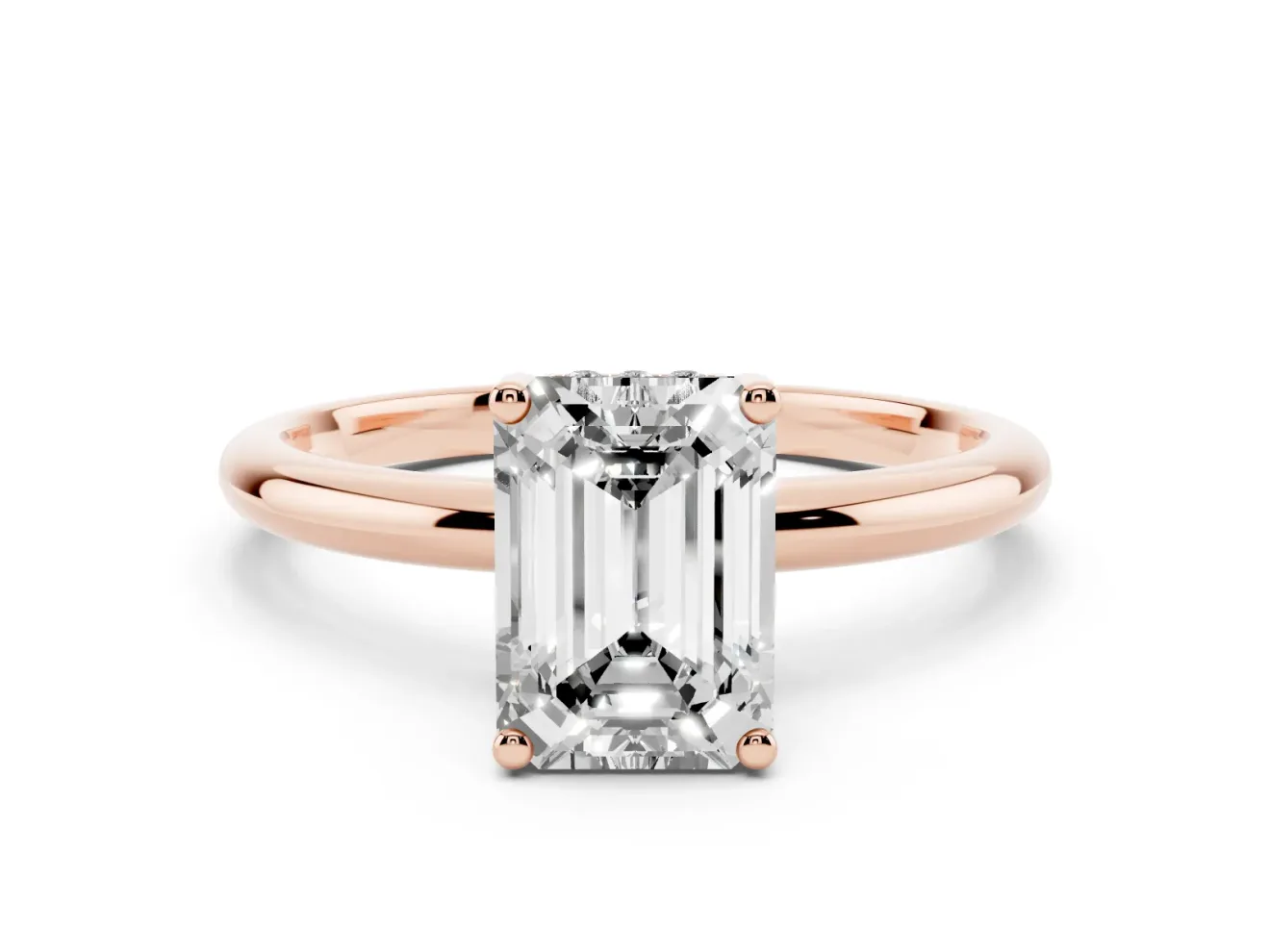 Emerald Cut Diamond Solitaire Engagement Ring Set in Rose gold with Prong Setting and Polished Band