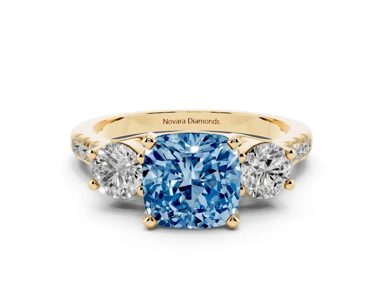 Fancy Blue Three-Stone Cushion Cut Diamond Pavé Band Ring Set in Yellow gold with Prong-Set Trio