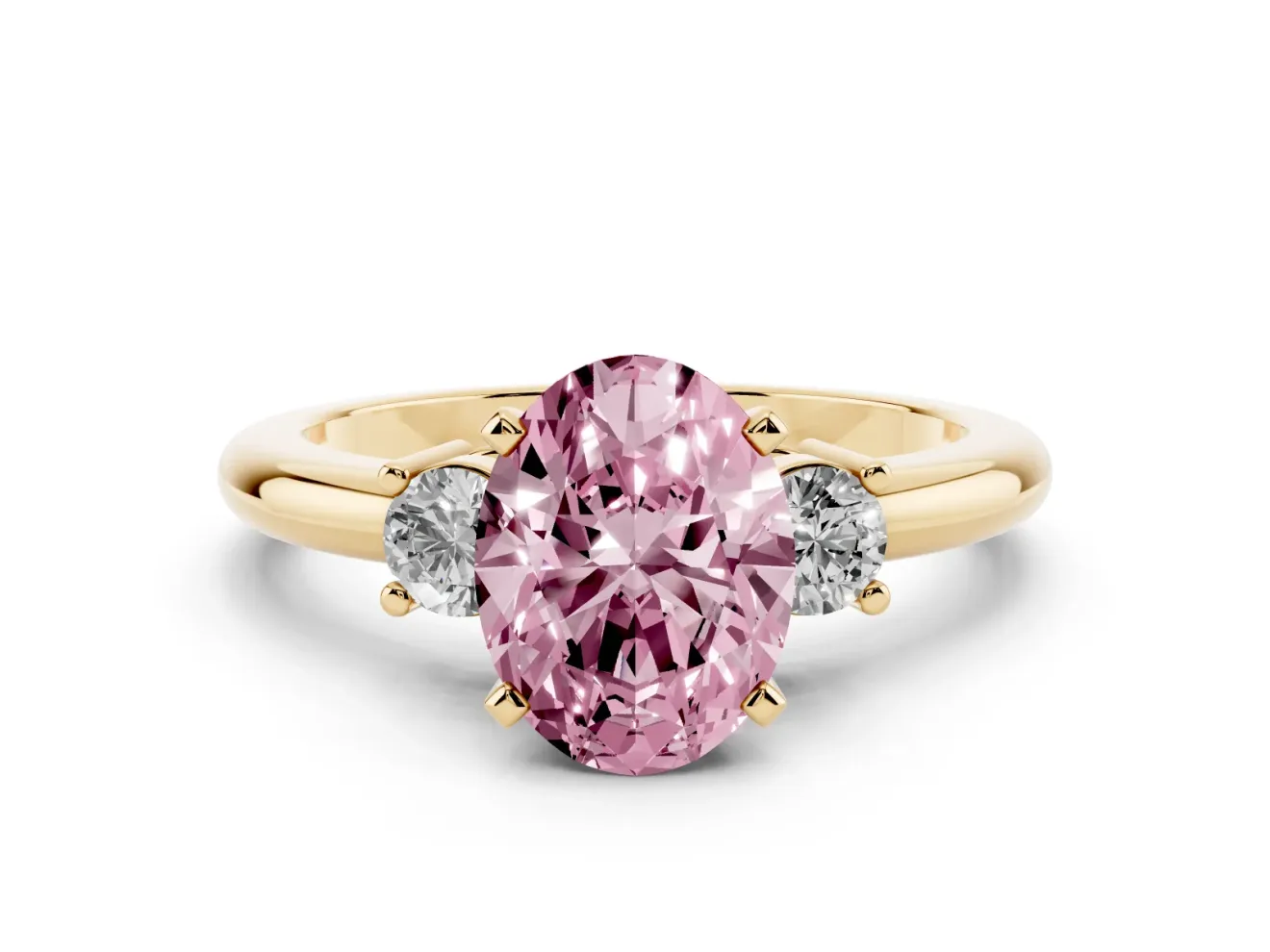 Fancy Pink Three-Stone Oval Cut Diamond Ring Set in Yellow gold with Prong Setting and Plain Band
