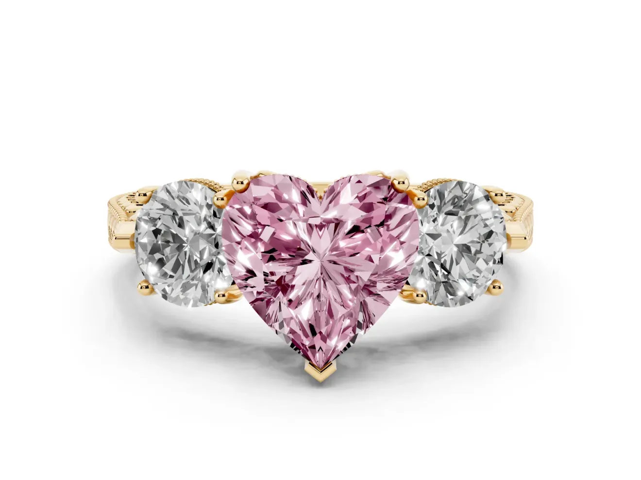 Fancy Pink Heart Cut Diamond Three-Stone Ring Set in Yellow gold with Milgrain Band