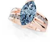 Fancy Blue Marquise Cut Diamond Solitaire Ring Set in Rose gold with Channel Set Split Shank and Tension Prongs