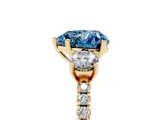 Fancy Blue Heart Cut Diamond Three-Stone Ring Set in Yellow gold with Pavé Band and Graduated Sides