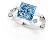 Fancy Blue Princess Cut Diamond Solitaire Ring Set in White gold with Side Stones on Criss-Cross Band and Prong Setting