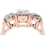 Emerald Cut Three Stone Engagement Ring Setting | Round Side Stones and Open Baskets | Rose Gold