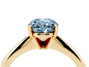 Fancy Blue Oval Cut Diamond Solitaire Ring Set in Yellow gold with Prong Setting on a Plain Round Band