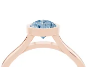 Fancy Blue Bezel Set Pear Cut Diamond Solitaire Ring Set in Rose gold with Tapered Band
