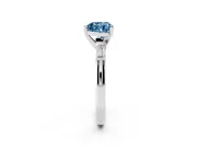 Fancy Blue Heart Cut Diamond Solitaire Ring Set in Silver with Tapered Baguette Side Stones and Prong Setting