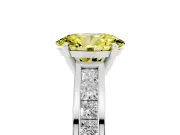 Fancy Yellow Oval Cut Diamond Solitaire Ring Set in White gold with Channel-Set Band and Prong Setting