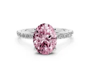 Fancy Pink Oval Cut Diamond Solitaire Ring Set in Platinum with Round Pavé Band and Prong Setting