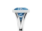 Fancy Blue Bezel Set Radiant Cut Diamond Solitaire Ring Set in Platinum with Tapered Band