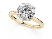 Round Cut Diamond Solitaire Engagement Ring Set in Yellow gold with Prong Setting and Polished Band