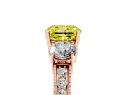 Fancy Yellow Cushion Cut Diamond Three-Stone Ring Set in Rose gold with Round Side Stones and Pavé Band