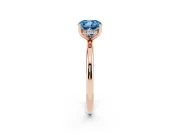 Fancy Blue Cushion Cut Diamond Solitaire Engagement Ring Set in Rose gold with Prong Setting and Polished Band