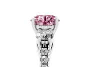 Fancy Pink Three-Stone Round Cut Diamond Pavé Band Ring Set in White gold with Prong-Set Trio