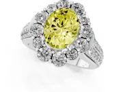 Fancy Yellow Oval Cut Diamond Halo Engagement Ring Set in White gold with Split Shank and Prong Setting