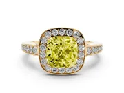 Fancy Yellow Cushion Cut Diamond Halo Pavé Engagement Ring Set in Yellow gold with Bezel Setting