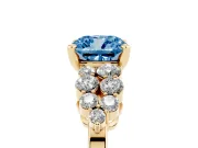Fancy Blue Cushion Cut Diamond Cluster Engagement Ring Set in Yellow gold with Pavé Band and Prong Setting