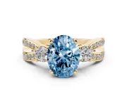Oval Three-Stone Twist Engagement Ring Setting for a Fancy Blue Lab-Grown Diamond | Yellow Gold