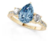 Fancy Blue Three-Stone Pear Cut Diamond Pavé Band Ring Set in Yellow gold with Prong Setting