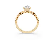 Marquise Cut Diamond Solitaire Engagement Ring Set in Yellow gold with Bezel Accents on Beaded Band