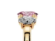 Fancy Pink Oval Cut Diamond Three-Stone Ring Set in Yellow gold with Polished Band and Prong Setting