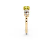 Fancy Yellow Cushion Cut Diamond Cluster Engagement Ring Set in Yellow gold with Pavé Band and Prong Setting