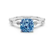 Fancy Blue Cushion Cut Diamond Solitaire Ring Set in White gold with Bezel Set Side Stones and Prong Setting