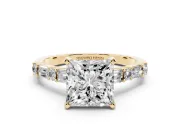 Princess Cut Diamond Solitaire Set in Yellow gold with Side Baguettes and Channel Set Band