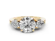 Round Cut Diamond Three-Stone Ring Set in Yellow gold with Pear Side Stones