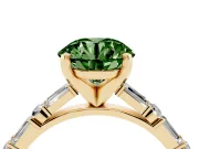 Fancy Green Round Cut Diamond Solitaire Set in Yellow gold with Side Baguettes and Channel Set Band