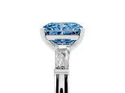 Fancy Blue Radiant Cut Diamond Solitaire Ring Set in Platinum with Tapered Baguette Side Stones and Prong Setting