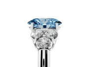 Fancy Blue Oval Cut Diamond Cluster Ring Set in Platinum with Round Accent Stones and Prong Setting on a Plain Band
