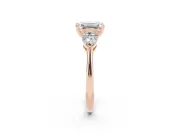 Three-Stone Emerald Cut Diamond Ring Set in Rose gold with Pear Side Stones and Prong Setting