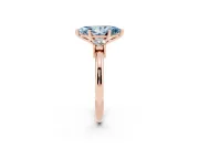Fancy Blue Three-Stone Marquise Cut Diamond Ring Set in Rose gold with Prong Setting and Plain Band
