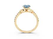Fancy Blue Oval Cut Diamond Solitaire Leaf-Inspired Ring Set in Yellow gold with Pavé Band and Prong Setting