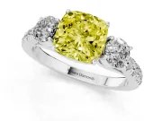 Fancy Yellow Cushion Cut Diamond Three-Stone Ring Set in White gold with Round Side Stones and Delicate Pavé Band