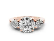 Round Cut Diamond Three-Stone Ring Set in Rose gold with Pear Side Stones