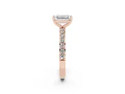 Emerald Cut Diamond Solitaire Set in Rose gold with Round Pavé Band and Prong Setting