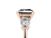 Fancy Black Three-Stone Princess Cut Diamond Ring Set in Rose gold with Pear Side Stones and Prong Setting