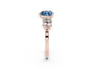 Fancy Blue Heart Cut Diamond Cluster Engagement Ring Set in Rose gold with Pavé Band and Prong Setting