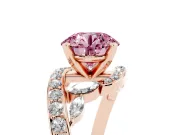 Fancy Pink Round Cut Diamond Solitaire Ring Set in Rose gold with Pavé Twist Band and Secure Prong Setting