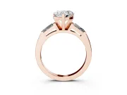 Heart Cut Diamond Solitaire Ring Set in Rose gold with Tapered Baguette Side Stones and Prong Setting