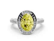 Fancy Yellow Oval Cut Diamond Halo Pavé Split Shank Ring Set in White gold with Prong Setting