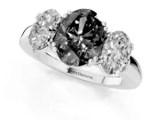 Fancy Black Oval Cut Diamond Three-Stone Ring Set in White gold with Polished Band and Prong Setting