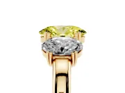 Fancy Yellow Oval Cut Diamond Three-Stone Ring Set in Yellow gold with Polished Band and Prong Setting